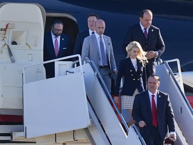 Jason Miller, Elon Musk, Stephen Miller, Boris Esphteyn, Natalie Harp and Dan Scavino, walk off President-elect Donald Trump's jet at Andrews Air Force Base. Picture: AP Photo/Alex Brandon