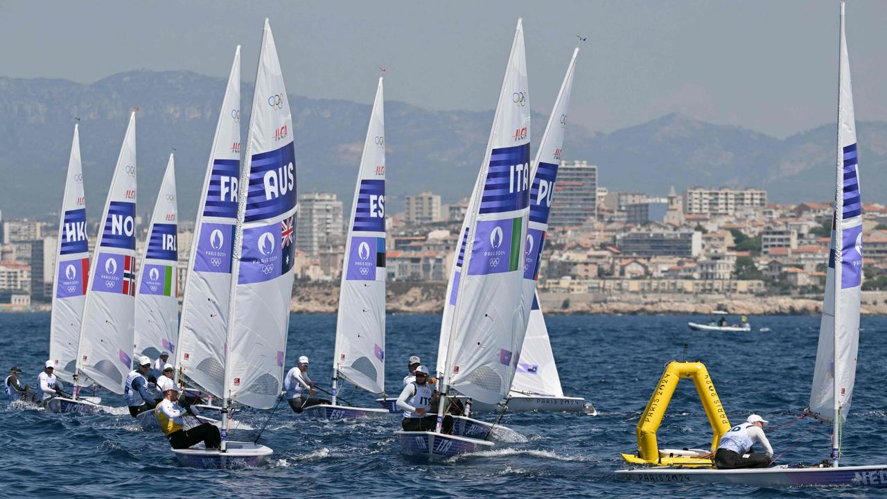 From left, Australia's Matt Wearn, Italy's Lorenzo Brando Chiavarini and the Netherlands' Duko Bos at right compete in race 7 of the men’s ILCA 7 single-handed dinghy event at the Roucas-Blanc Marina in Marseille on August 4. Picture: Nicolas Tucat/AFP