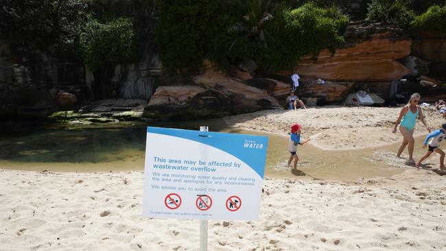 Children playing in the stormwater overflow pipe at Coogee Beach last week. Picture: Craig Wilson