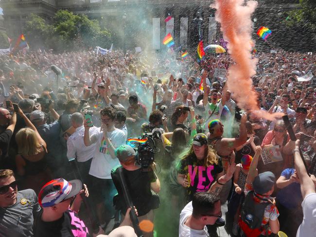 The crowd react to the same-sex marriage postal survey Yes result in front of the State library of Victoria in Melbourne, Wednesday, November 15, 2017. Picture: AAP Image/David Crosling