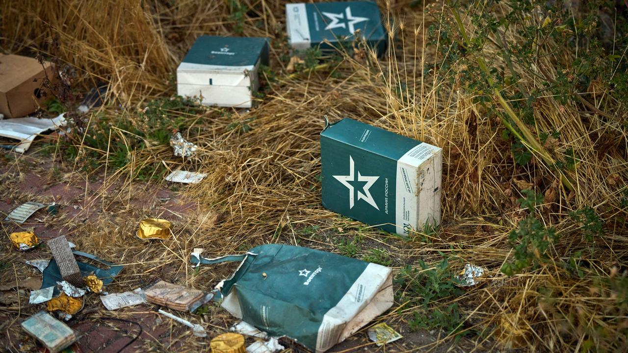 Russian food rations on the ground at Snake Island (Zmiinyi Island) where Ukraine defenders famously defied a Russian warship at the beginning of the invasion. Picture: Ukraine Presidential Press Service/AFP