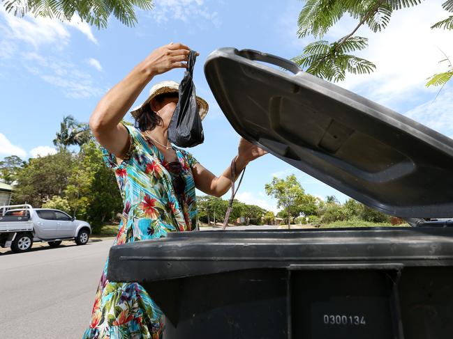 Western suburbs dog owners got into a heated online debate last week about whether it's okay to dump their dog's poo in a strangers' wheelie bin.  Yumi Schafer of Bellbowrie.   Pic: Josh Woning.