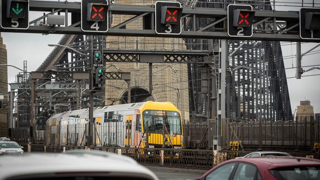 A train approaches Milsons Point railway station, where the traffic precinct will be one of four to introduce 40kmh limits (see graphic above).