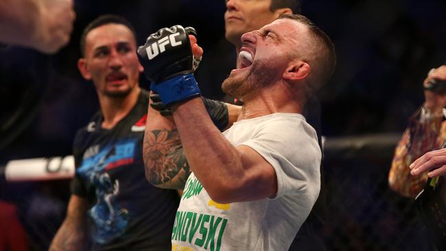 Alex Volkanovski roars with delight following his win over Max Holloway. Picture: Richard Dobson