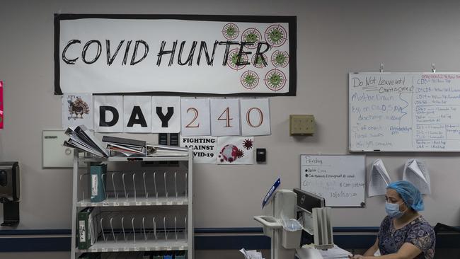 A medical staffer member works on a computer as the number on the wall indicates the days since the hospital opened its COVID-19 unit at United Memorial Medical Center in Houston, Texas. According to reports, Texas has reached over 1,070,000 cases, including over 19,900 deaths. Picture: Go Nakamura/Getty Images/AFP