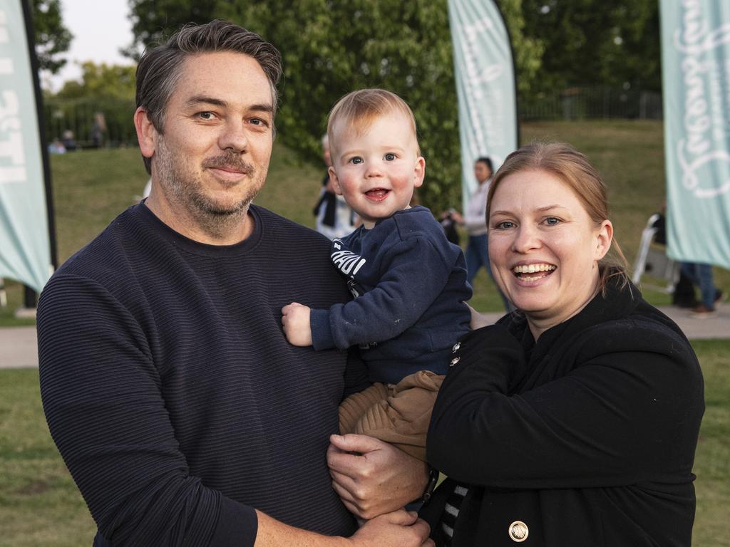 Scott and Joanna Clarke with their son Emrys at the Symphony Under the Stars concert performed by the Queensland Symphony Orchestra in Queens Park Amphitheatre for Carnival of Flowers, Friday, October 4, 2024. Picture: Kevin Farmer