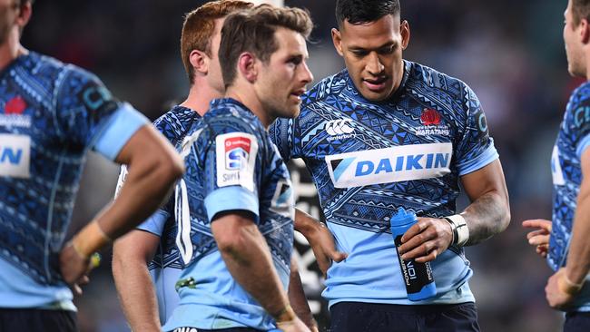 A dejected Israel Folau (2nd from right) of the Waratahs  during the round 16 Super Rugby match between the NSW Waratahs and Argentina's Jaguares at Allianz Stadium in Sydney, Saturday, July 8, 2017.  (AAP Image/Dean Lewins) NO ARCHIVING