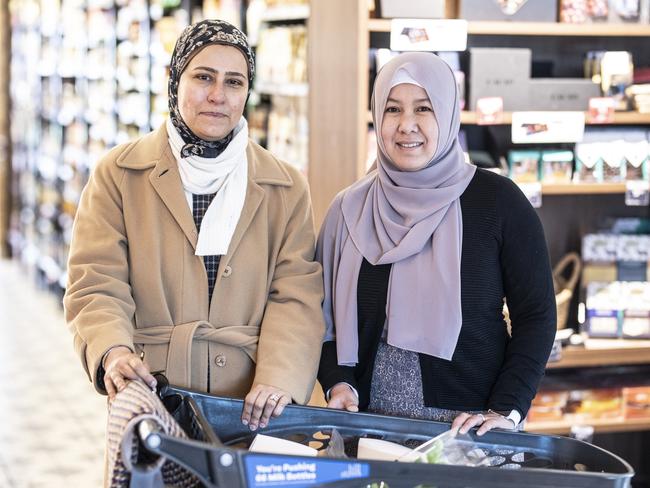 Hill Street Sandy Bay shoppers, Zeinab Badr and Julia Roshalina are interviewed about Check In Tas app changes. Picture Eddie Safarik