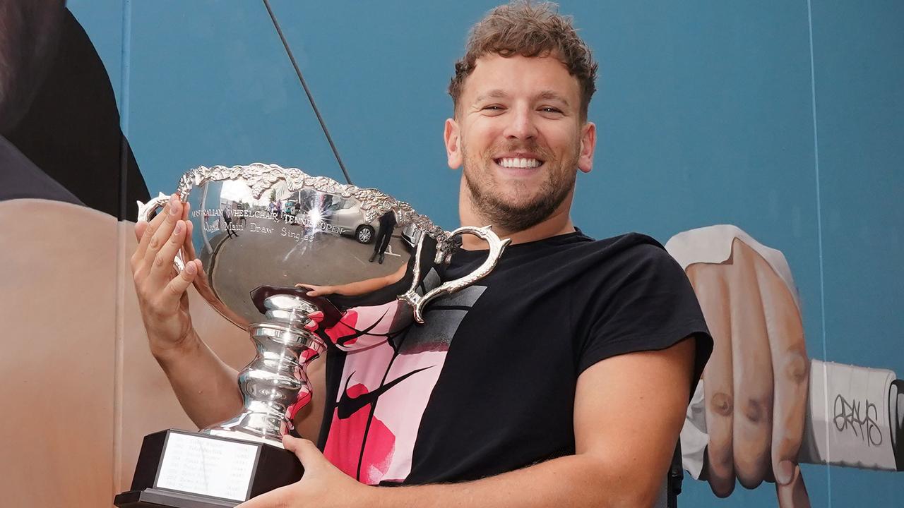 Dylan Alcott of Australia with his men’s quad wheelchair singles trophy. Picture: AAP