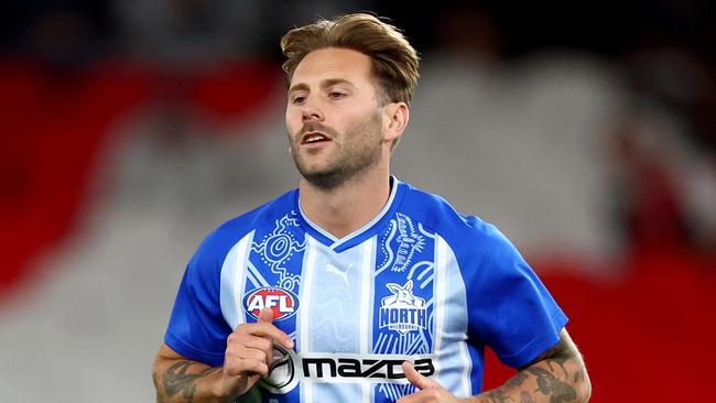 MELBOURNE, AUSTRALIA - MAY 01: Caleb Daniel of the Kangaroos warms up ahead of his 200th game during the round eight AFL match between Essendon Bombers and North Melbourne Kangaroos at Marvel Stadium, on May 01, 2025, in Melbourne, Australia. (Photo by Josh Chadwick/Getty Images)