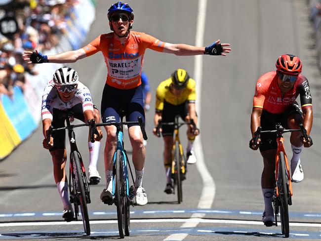 MOUNT LOFTY, AUSTRALIA - JANUARY 21: Stephen Williams of United Kingdom and Team Israel - Premier Tech - Orange Santos Leader's Jersey celebrates at finish line as stage winner ahead of Isaac Del Toro Romero of Mexico and UAE Team Emirates and Jhonatan Narvaez of Ecuador and Team INEOS Grenadiers during the 24th Santos Tour Down Under 2024, Stage 6 a 128.2km stage from Unley to Mount Lofty 648m / #UCIWT / on January 21, 2024 in Mount Lofty, Australia. (Photo by Tim de Waele/Getty Images)