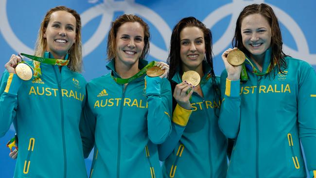 Australia’s 4x100m relay team show off their gold medals.