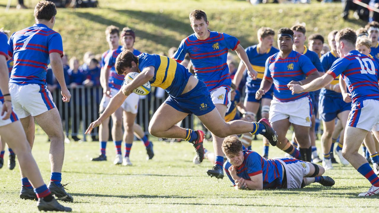 Grammar's Tom Bailey gets away from the Downlands players.