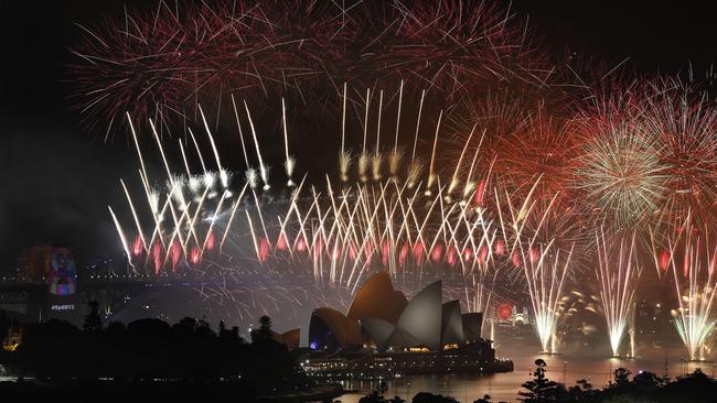 Red was a strong colour theme for the midnight fireworks. Picture: Toby Zerna