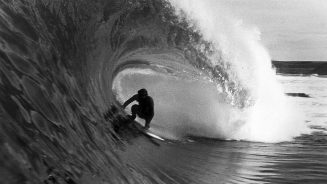 In the eye of the storm, Laurie Thomson catches a wave at Phillip Island.