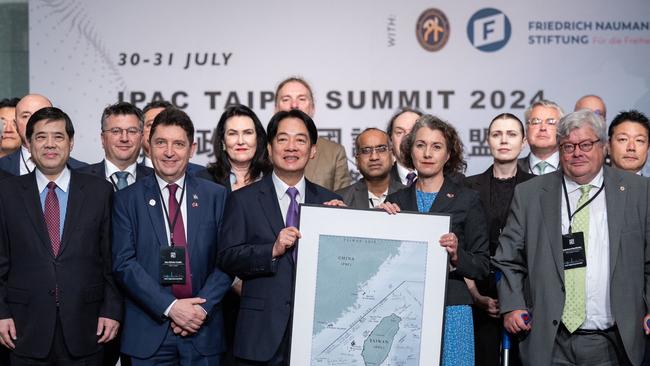 Taiwan's President Lai Ching-te holding a map of Taiwan with British MP Sarah Champion, a member of the Inter-Parliamentary Alliance on China, during a meeting in Taipei. Picture: Supplied/AFP