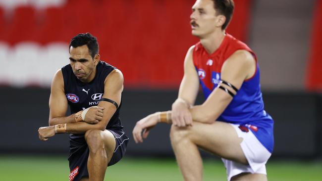 Eddie Betts and Jake Lever take the knee in support of Black Lives Matter before the Carlton and Melbourne clash on Saturday Picture: Michael Klein