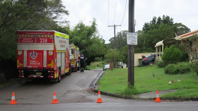 Cathy Crescent, Narara, remains blocked off as police a firefighters render the house safe. Picture: Richard Noone