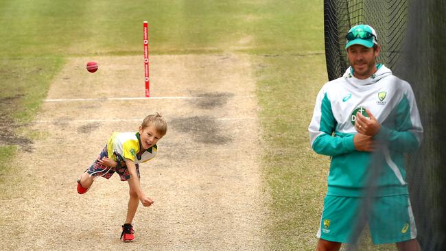 An eager young cricketer bowls a pitch next to Marnus Labuschagne. Picture: Getty Images
