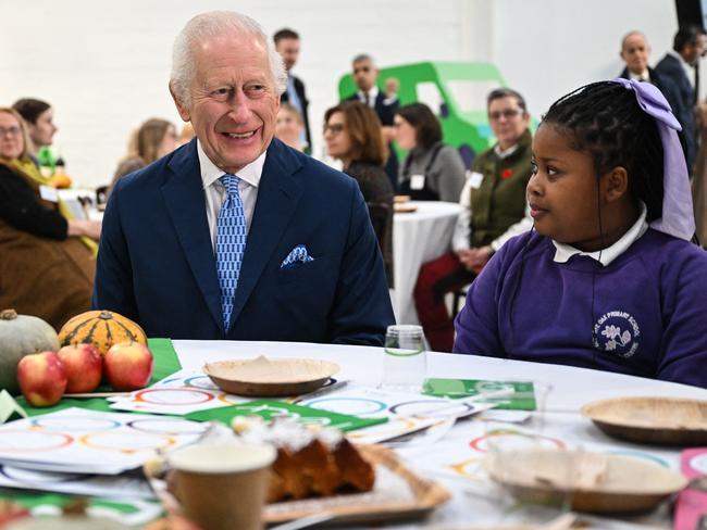 King Charles III speaks with pupils of the primary school Rye Oak which benefits from the Coronation Food Project. Picture: AFP