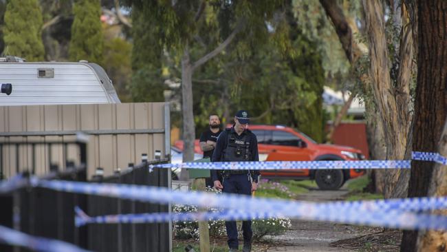 Police officers examine the area. Picture: RoyVPhotography