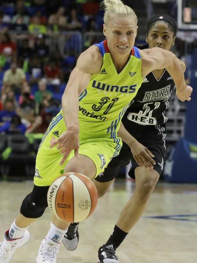 Dallas Wings guard Erin Phillips dribbles against San Antonio Stars guard Sydney Colson last year in Texas. Picture: AP Photo/LM Otero