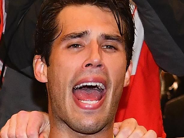 MELBOURNE, AUSTRALIA - APRIL 24:  Kane Lambert, Jack Riewoldt, Alex Rance and Reece Conca of the Tigers  sing the song in the rooms after winning the round five AFL match between the Richmond Tigers and the Melbourne Demons at Melbourne Cricket Ground on April 24, 2017 in Melbourne, Australia.  (Photo by Quinn Rooney/Getty Images)