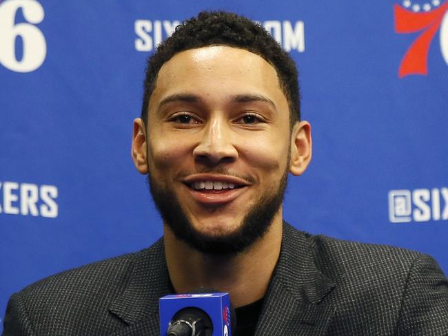 FILE - In this March 11, 2020, file photo, Philadelphia 76ers' Ben Simmons smiles while speaking at a news conference before an NBA basketball game against the Detroit Pistons in Philadelphia. Video games have become a go-to hobby for millions self-isolating around the world, and athletes from preps to pros have eagerly grabbed the controls. Stars like Ben Simmons and Luka Doncic have turned to gaming to stay connected with fans.(AP Photo/Matt Slocum, File)