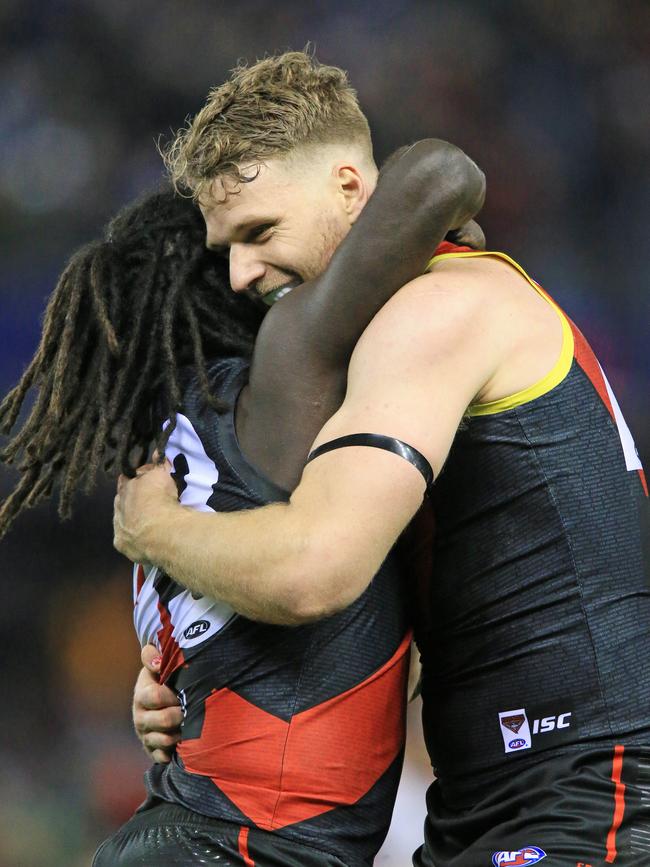 And gets a hug from teammate Jake Stringer on the siren. Picture: Mark Stewart