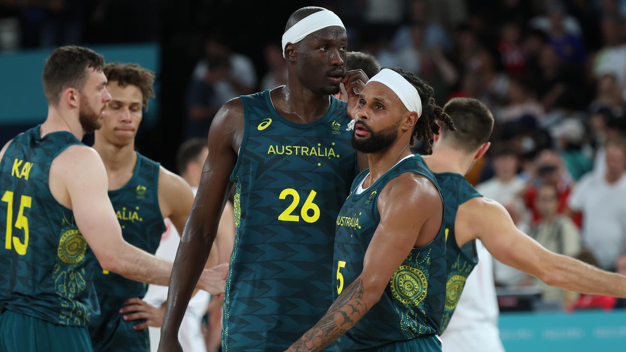 Boomers stars Duop Reath (26) and Patty Mills (5) following Australia’s quarterfinal loss to Serbia.