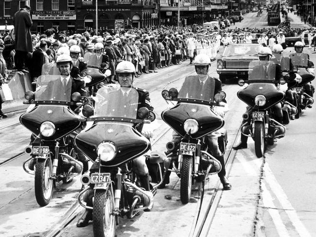 1966: Police on BMW R69 motorcycles escort the funeral procession of the Governor of Victoria, Sir Dallas Brooks, on Swanston St, Melbourne. File picture