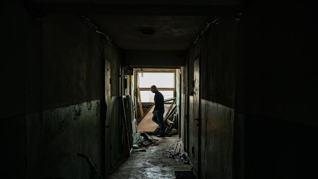 A man walks down a corridor of a damaged apartment building following missile strikes in Dnipro, Ukraine. Picture: AFP