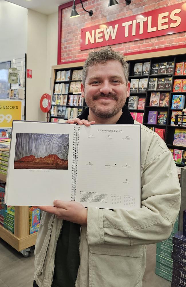 Brody Gamble with his image "Rainbow Valley – Valley of the Stars", which will feature in the 2025 Australian Geographic Diary.