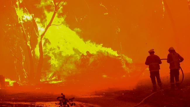 Firefighters from the Killara RFS battle the Gospers Mountain along the Bells Line of Road on Saturday. Picture: Matrix
