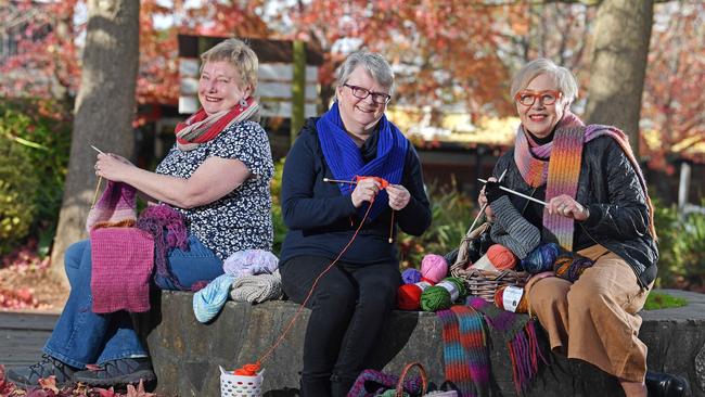 Di Liebelt, Uraidla CWA, Linda Terrel, Mt Barker CWA, and Julie Kimber, Stirling CWA, knitting gifts to be sold for charity. Pictured outside Fleurs at Stirling. Picture: Tom Huntley