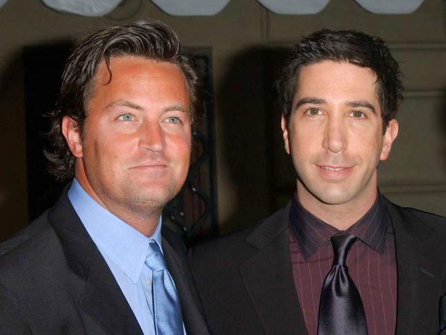 (FILES) Actors Matthey Perry (L), David Schwimmer (C) and Matt Leblanc (R) attend the 28th Annual People's Choice Awards in Pasadena on January 12, 2002. Matthew Perry, one of the stars of smash hit TV sitcom "Friends," has been found dead at his home, US media reported Saturday October 28. He was 54. Law enforcement sources told the Los Angeles Times that Perry was found unresponsive in a hot tub at his Los Angeles home. The LA Times and TMZ, which first reported the news, both said there were no signs of foul play, citing anonymous sources. (Photo by Chris Delmas / AFP)