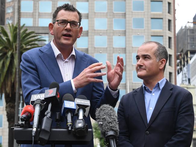 Victorian Premier Daniel Andrews and Deputy Premier James Merlino during a press conference outside Treasury Place, Melbourne, Sunday, November 25, 2018. The Andrews Labor Party has successfully been re-elected following the 2018 Victorian State Election. (AAP Image/James Ross) NO ARCHIVING