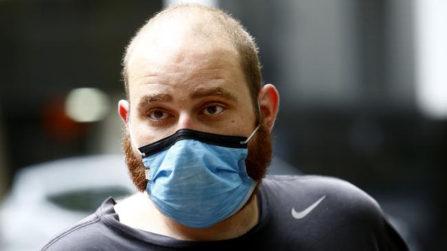 Mathew Stephan leaves Sydney Police Centre at Surry Hills, released after being charged and sentenced for three times breaking the NSW self isolation laws. Picture: John Appleyard