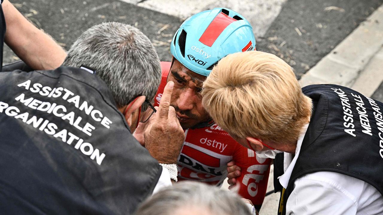 Australian rider Caleb Ewan reacts to medical staff after suffering a crash during the 5th stage of the Tour de France.(Photo by Marco BERTORELLO / AFP)