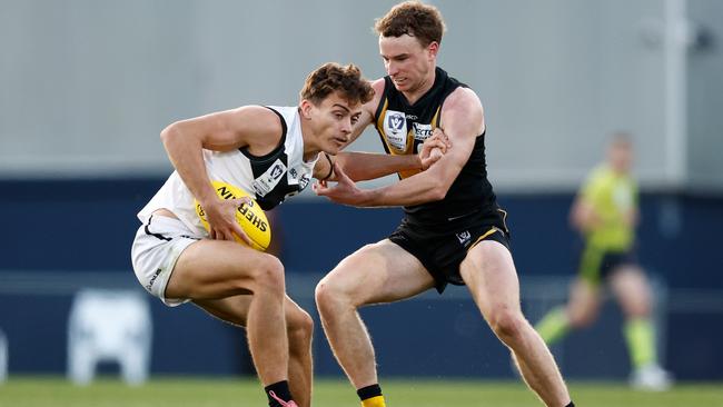 Jacob Heron of the Sharks is tackled by Jack Henderson of the Tigers during the 2024 VFL Grand Final. Photo: Michael Willson/AFL Photos via Getty Images.