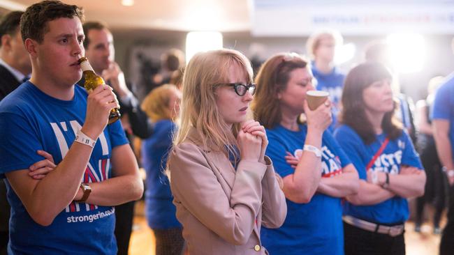 Supporters of the 'Stronger In' Campaign watch the results of the EU referendum being announced at a results party at the Royal Festival Hall in London. Picture: Rob Stothard/AFP