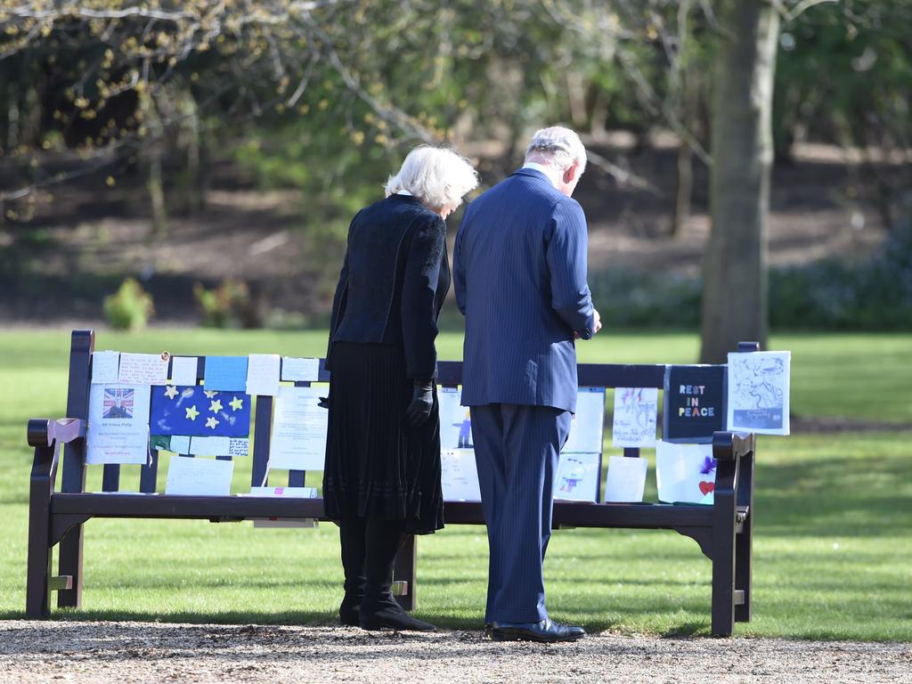 The Prince of Wales and Duchess of Cornwall looked at the tributes left by members of the public outside Buckingham Palace and Windsor and moved to the area due to COVID concerns. Picture: Jeremy Selwyn - WPA Pool/Getty Images