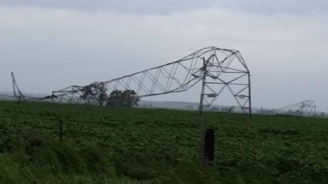 Power towers crumpled in strong winds five kilometres north of Melrose. Picture: Debbie Prosser