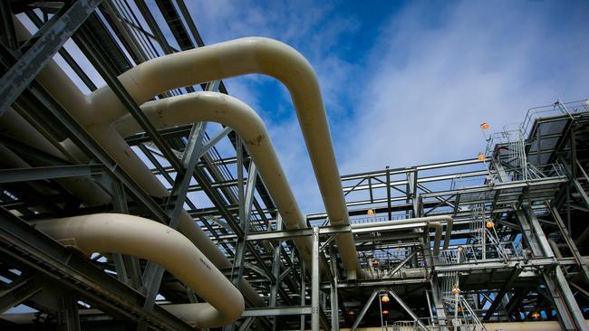 Gas pipes run through a plant at the Queensland Curtis Liquefied Natural Gas (QCLNG) project site, operated by QGC Pty, a unit of Royal Dutch Shell Plc, in Gladstone, Australia, on Wednesday, June 15, 2016. Gas from more than 2,500 wells travels hundreds of miles by pipeline to the project, where it's chilled and pumped into 10-story-high tanks before being loaded onto massive ships. Photographer: Patrick Hamilton/Bloomberg