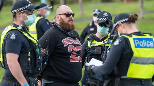 Police make arrests at All Nations Park behind Northcote Plaza. Picture: Tony Gough