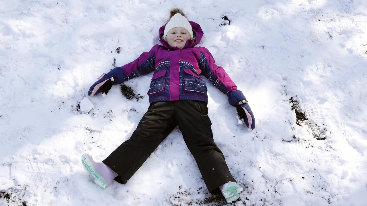 Amelia Deonck, 4, from Winmalee enjoying the snow in Bloome Park at Leura in the Blue Mountains. Picture: Jonathan Ng