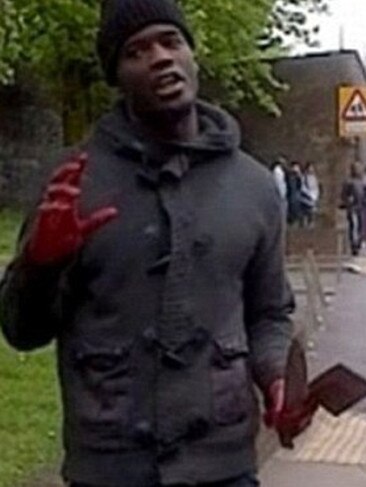 Michael Adebolajo appearing on TV with blood on his hands and holding a knife and a meat cleaver after killing and mutilating Lee Rigby on a London street.