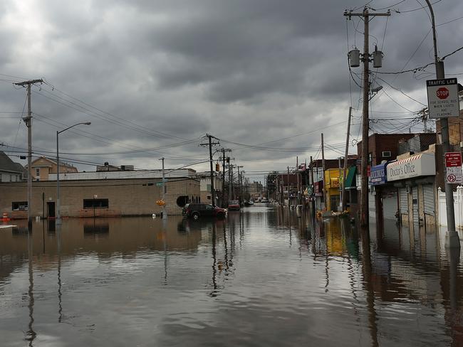 Flood damaged streets are viewed in the Rockaway section of Queens where the historic boardwalk was washed away due to Hurricane Sandy on October 31, 2012 in the Queens borough of New York City. Picture: Spencer Platt/Getty Images/AFP