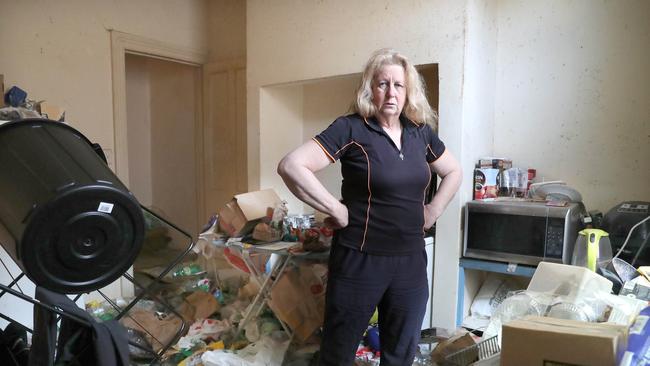 Kim Woodcock owner of the property in the kitchen of the house. Rental property in Hobart that has been left with huge amounts of rubbish after the tenant vacated. Picture: Nikki Davis-Jones