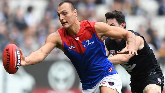 Braydon Preuss of the Demons (left) and Mitch McGovern of the Blues contest during the Round 16 AFL match between the Carlton Blues and the Melbourne Demons at the MCG in Melbourne, Sunday, July 7, 2019. (AAP Image/Julian Smith) NO ARCHIVING, EDITORIAL USE ONLY